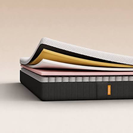 Emma mattress construction shown layer by layer on a neutral background